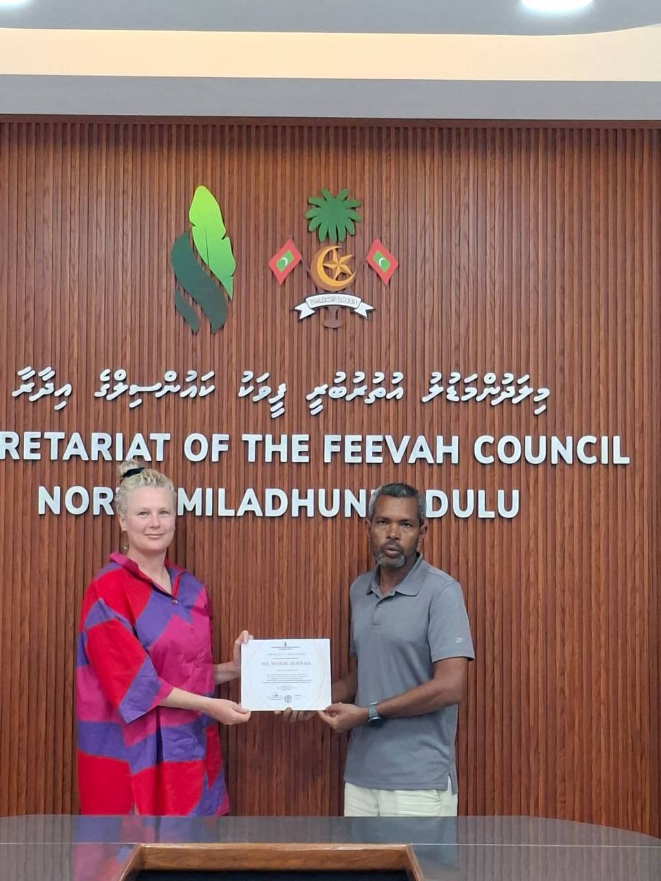 Feevah Island Council presents Marije with a certificate recognising her as the island's first international visitor
