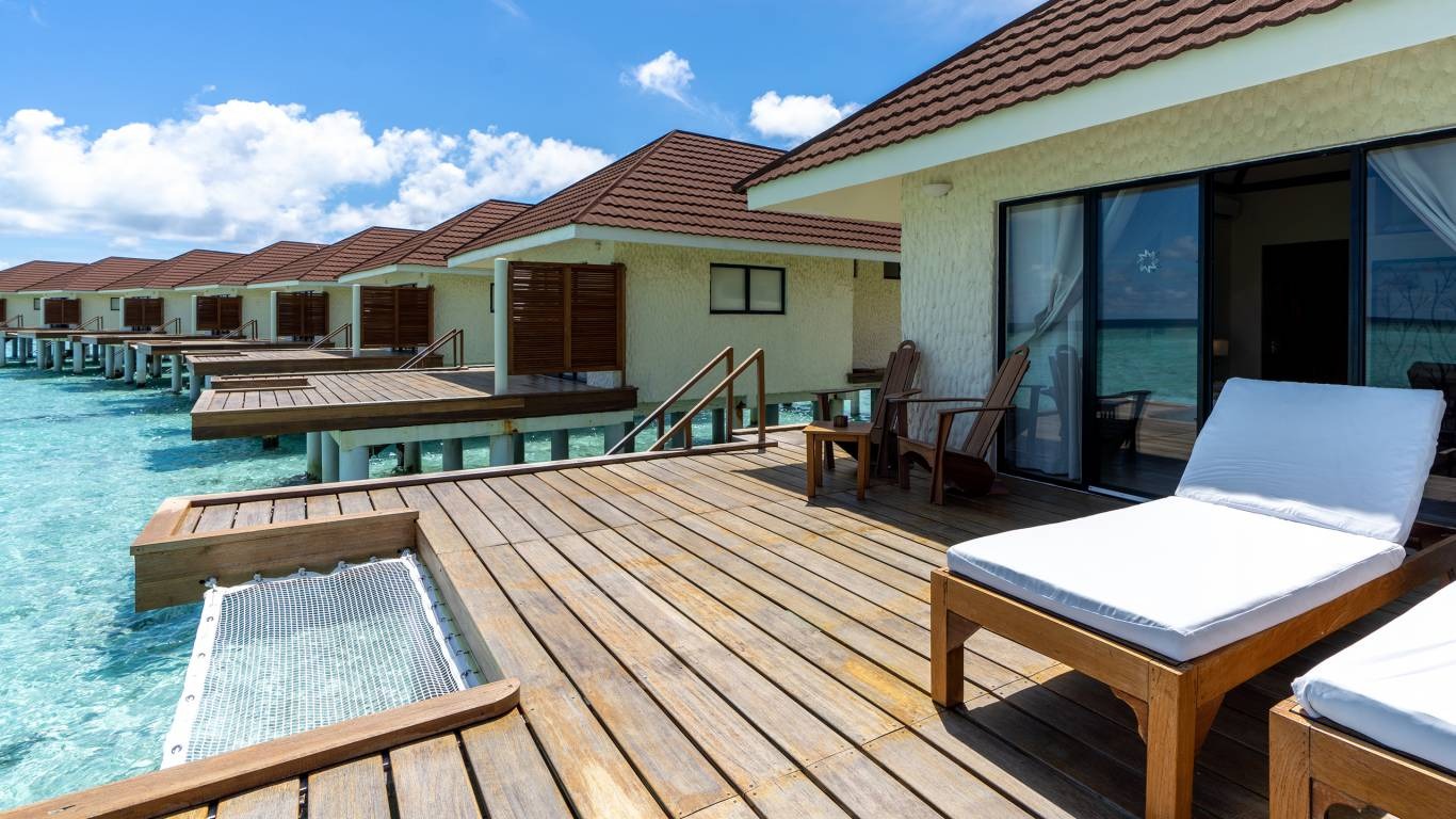 Alimatha Aquatic Resort — overwater bungalow deck, Vaavu Atoll